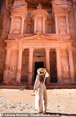 Adriana, pictured in Petra, Jordan, suggests it may be more difficult to travel 'with very young children when exploring remote areas' and places without family-friendly facilities