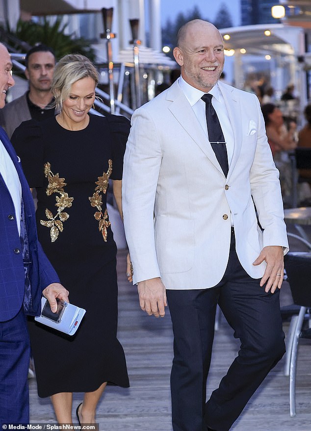 She wore her blonde hair in a sleek updo for the occasion and carried a white mother-of-pearl handbag with metal details.