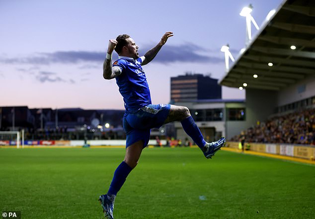 Chris Maguire celebrated leveling the score from the spot, sending the match into replay