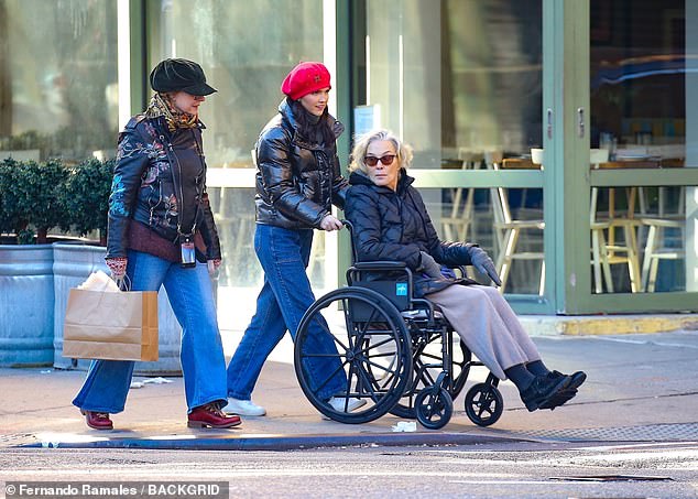 Lange, 74, was in a wheelchair and was pushed by a woman wearing a red beret