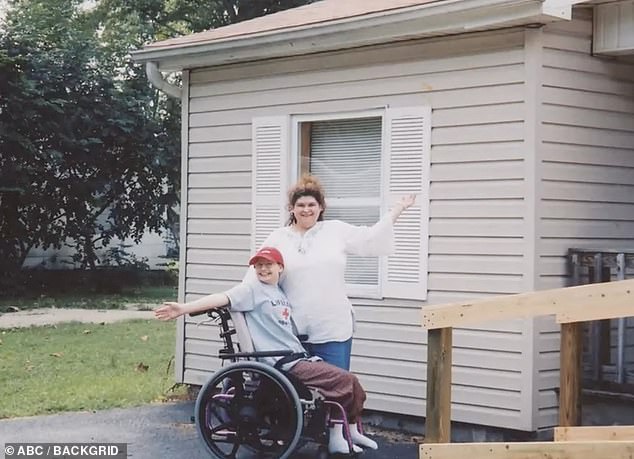 She is depicted in a wheelchair next to her mother, who suffered from mental illness