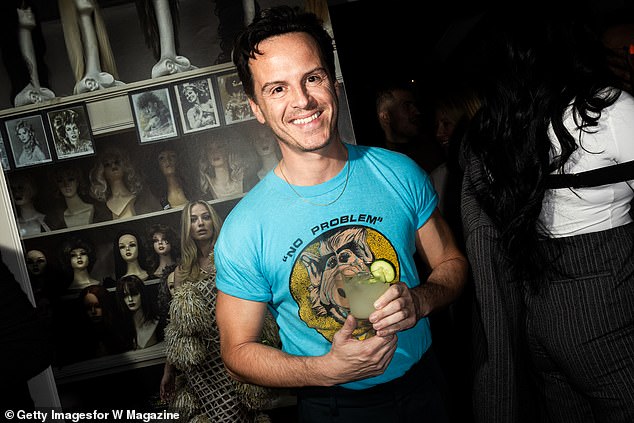 The Irish actor, 47, showed off his bulging biceps in a blue short-sleeved T-shirt with the character Alf printed on the front