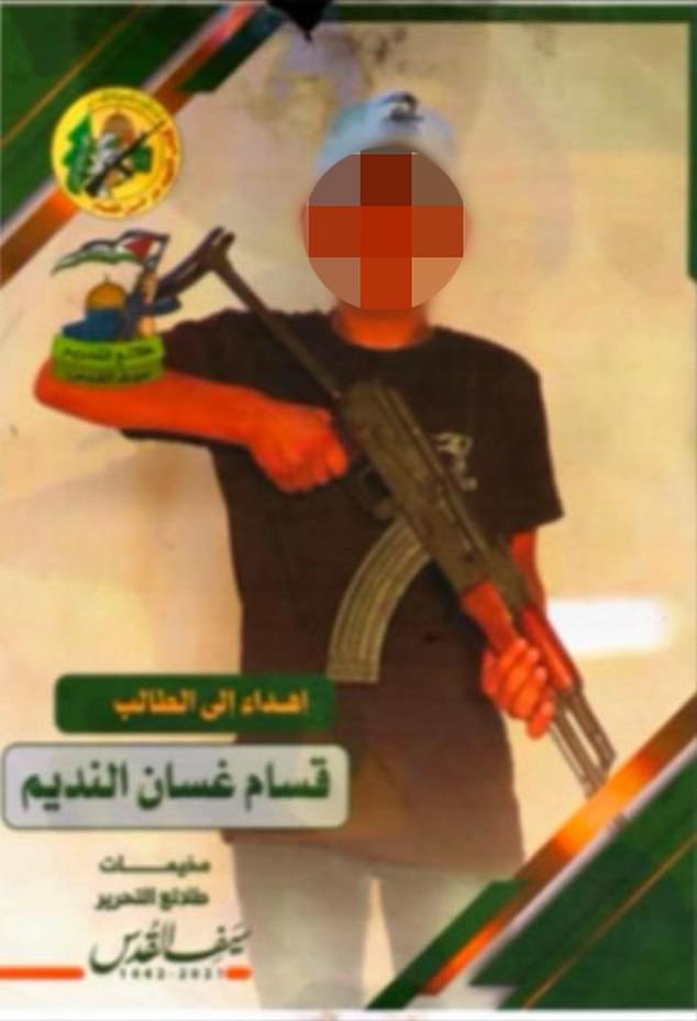 An image released by the Israeli military shows a child holding an assault rifle