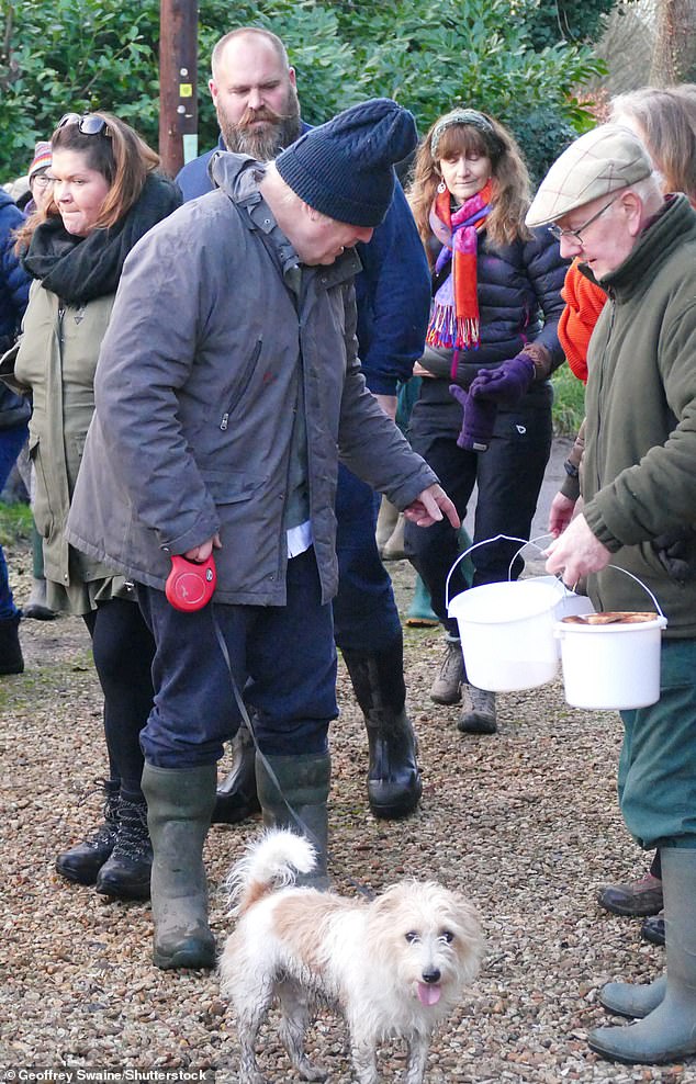 The Prime Minister was accompanied by his terrier dog Dilyn, who appears to have walked through muddy puddles on the way to the festival