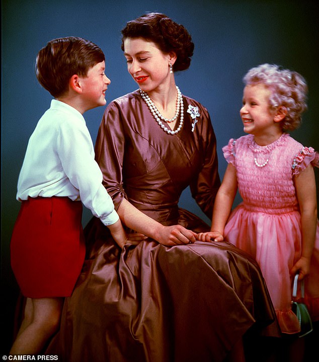 Prince Charles (6) and Princess Anne (4) pose with their mother in 1954