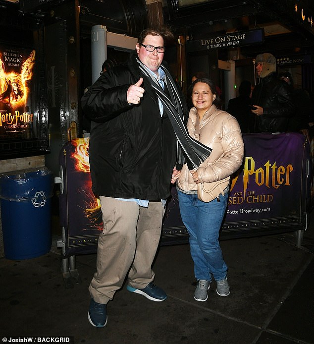 She wore a champagne-colored puffer coat with a matching saddle bag to match her otherwise casual outfit of jeans and gray sneakers