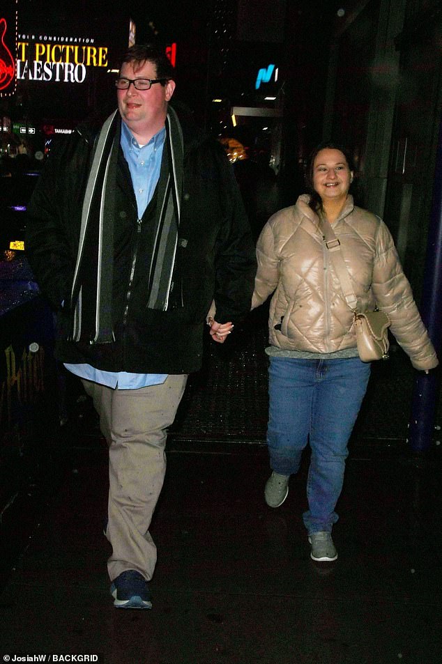 As they strolled around the city, they looked blissful and lovingly held hands