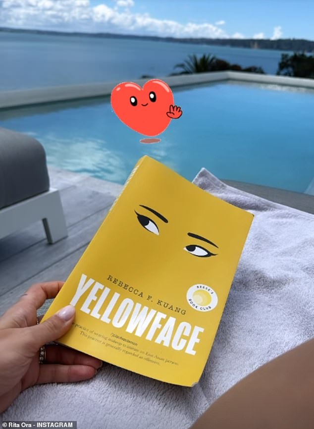 The 33-year-old singer soaked up the sun while reading her book during a lavish vacation with picturesque views of an infinity pool and the ocean