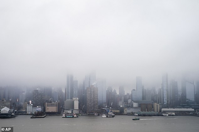 The Manhattan skyline was blanketed during a winter storm on Sunday