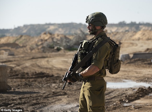 An Israeli soldier exits a tunnel that Hamas reportedly used to attack Israel through the Erez border crossing on January 7, 2024 in northern Gaza