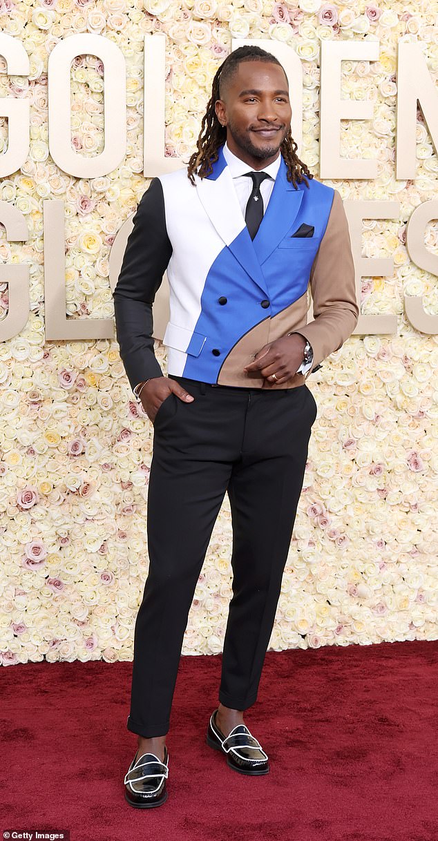 Barbie star Scott Evans raised eyebrows when he showed up at the event in a multi-colored suit with black, white, blue and tan wavy stripes across it