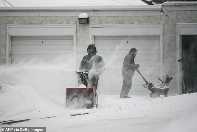 The cold shock would bring temperatures more than 78 degrees below normal for this time of year.  Pictured: People work to remove snow from driveways in Minneapolis in February 2023