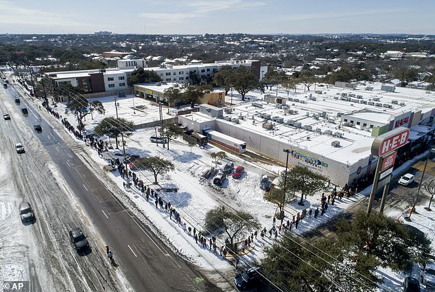 People wait in a long line to buy groceries at HEB in Austin, Texas, during the state's 2021 extreme cold snap and widespread power outage