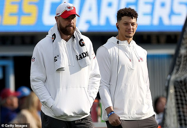 Kelce and Mahomes watch from the sidelines during the 13-12 victory for Kansas City