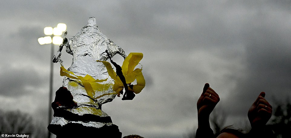 One supporter had made a makeshift FA Cup trophy from aluminum foil and ribbon and proudly held it aloft