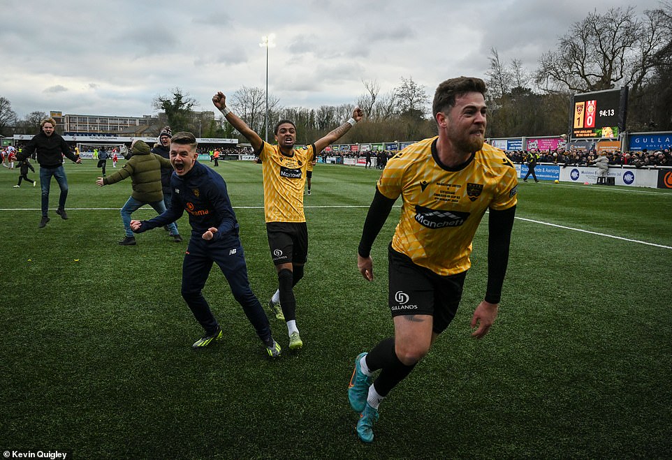 Players, supporters and coaches rushed onto the pitch at full-time after the home side booked their place in the fourth round