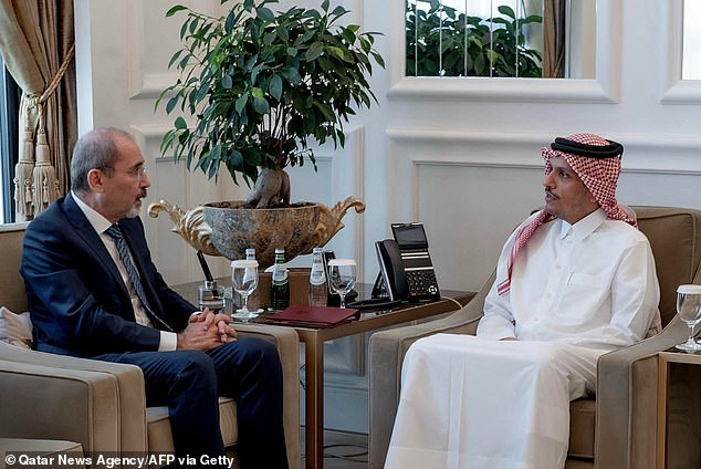 Qatar's Prime Minister and Minister of Foreign Affairs, Sheikh Mohammed bin Abdulrahman bin Jassim al-Thani (R), receives Jordanian Foreign Minister Ayman Safadi in Doha