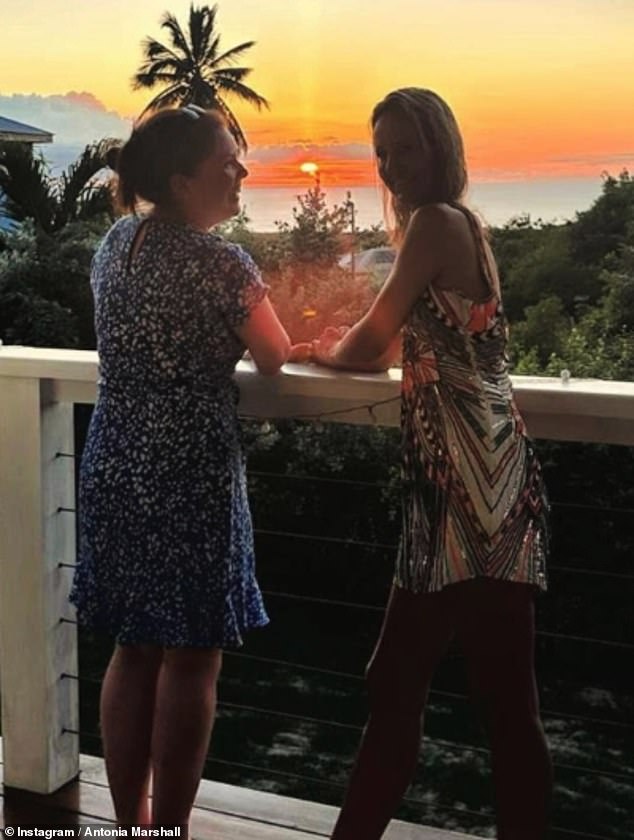 The couple were also pictured posing on a balcony as they enjoyed the island views during their getaway