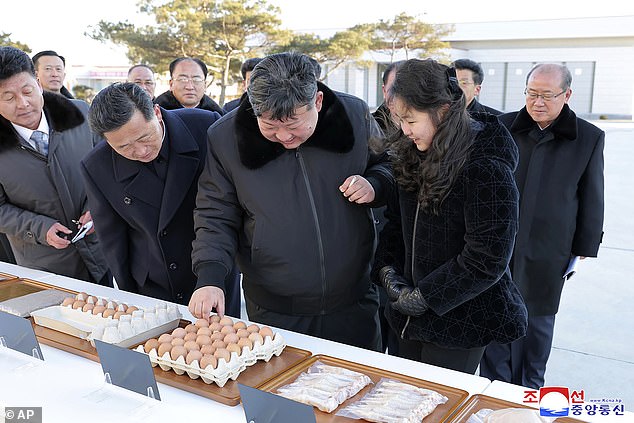 Kim and his daughter check out the produce at the chicken farm in photos released on what is reportedly his 40th birthday