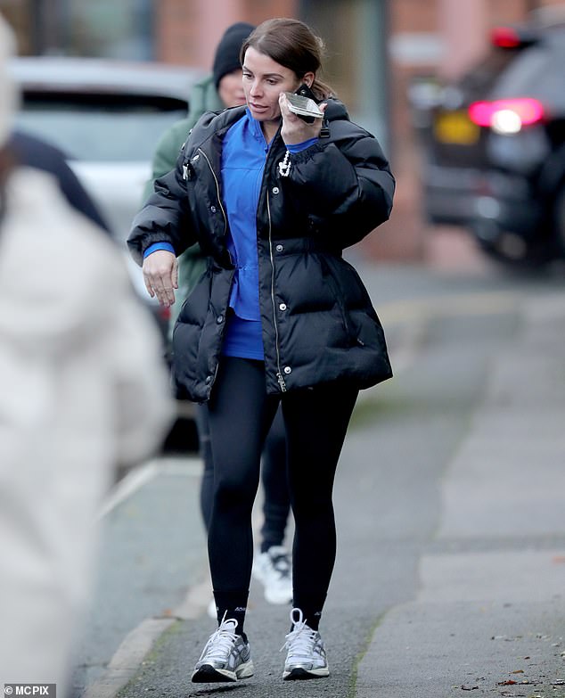 Coleen appeared busy on her phone as she listened to an audio from the device - just days after husband Wayne, 38, was sacked as manager of Birmingham City