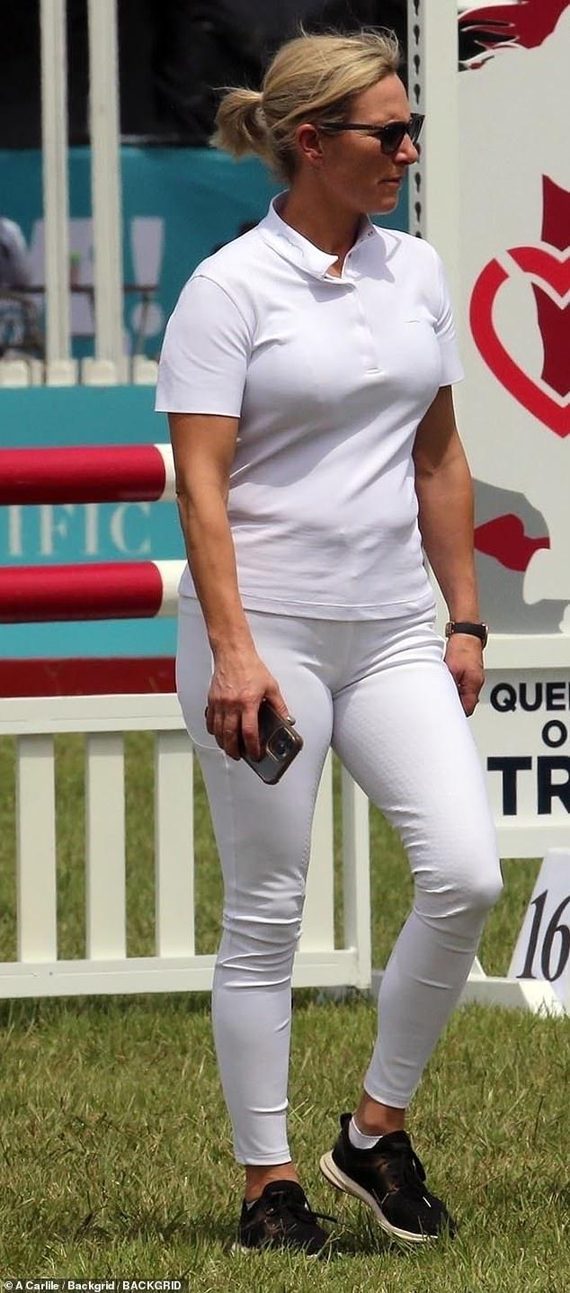 Some photos appeared to show Zara enjoying some time to relax during her action-packed day, as she donned an all-white riding outfit and a pair of black sneakers