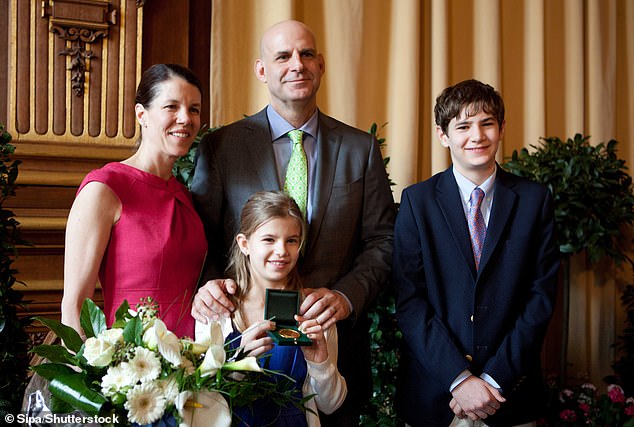 Cobden has four children with his wife Anne Armstrong.  Above: The couple in 2011 with two of their children
