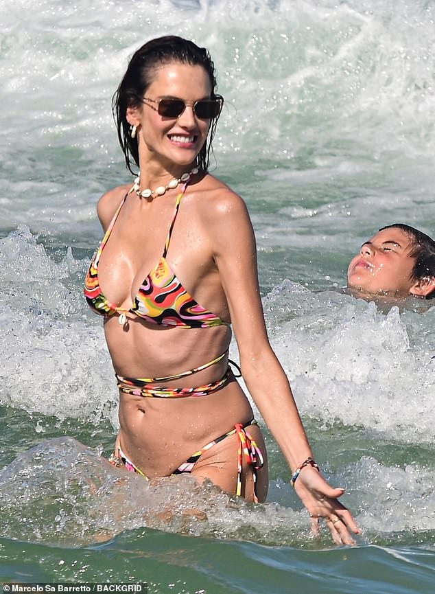 Cooling down from the hot weather, Alessandra looked sensational as she went for a swim in the ocean