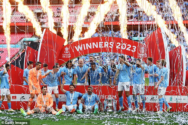 Manchester City celebrates FA Cup victory over Manchester United (above)