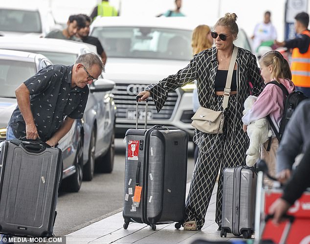 Craig, a television producer, looked focused as they headed to the departure lounge to fly to a secret location