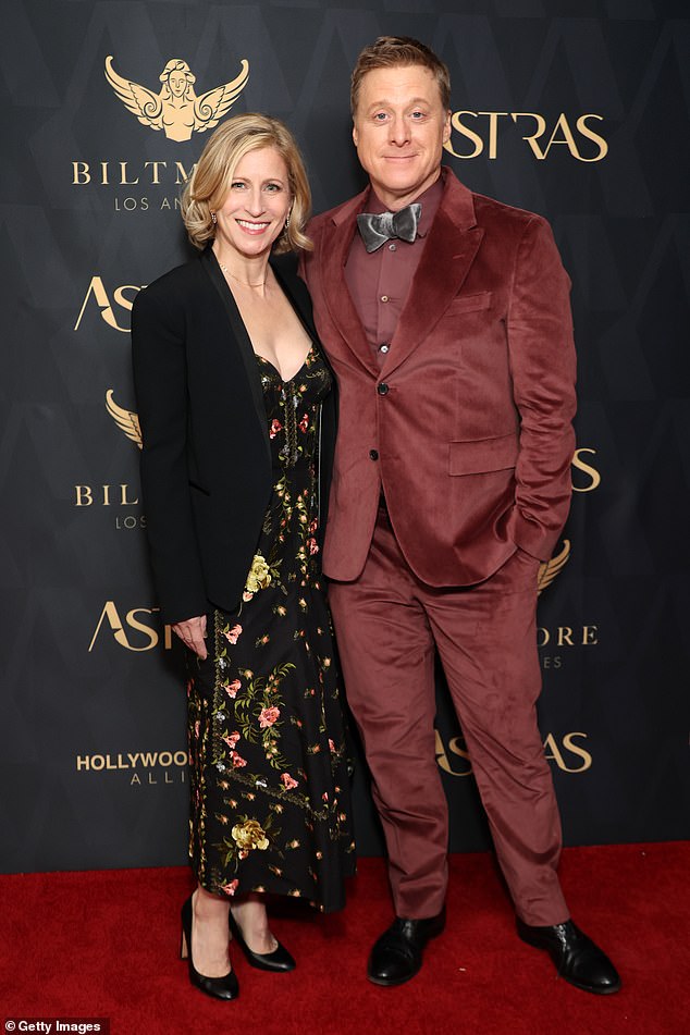 Charissa Barton and Alan Tudyk coordinated in black and dark blush shades