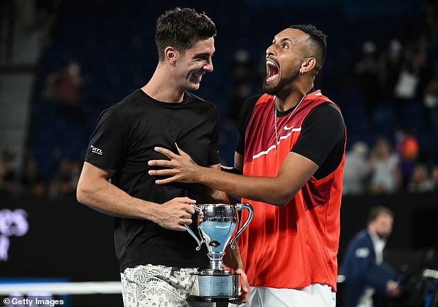 Nick Kyrgios described the crowd at Melbourne Park as a 'zoo' as he and Thanasi Kokkinakis won the 2022 men's doubles title (pictured)