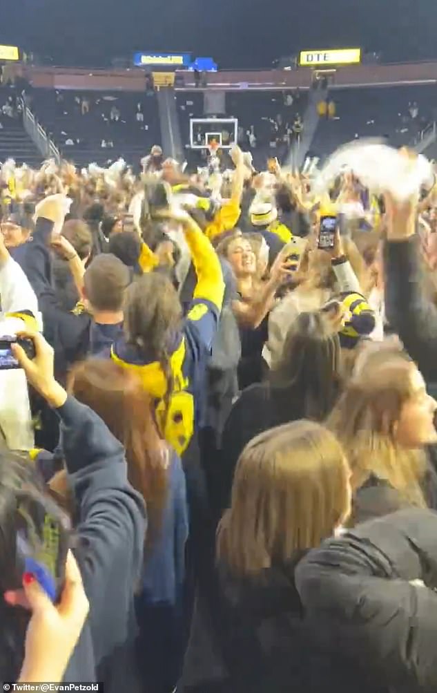 Wolverines supporters sing the team's unofficial anthem, Mr. Brightside, at the Crisler Center