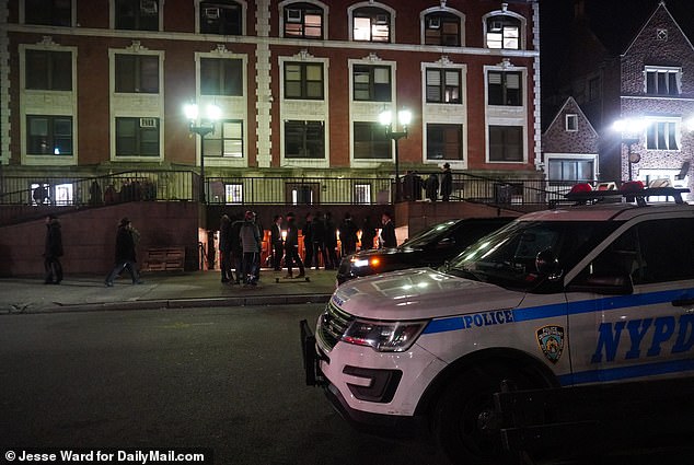 A police cruiser is seen outside the building, at 770 Eastern Parkway