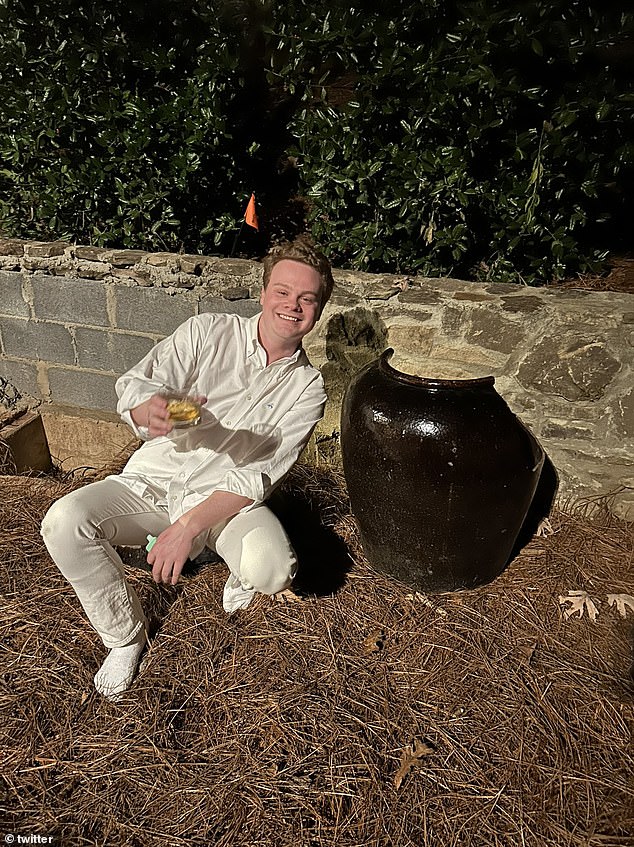 Reported: Connor posed with the broken urn after his friends finally had to beat him out of it at the New Year's Eve party