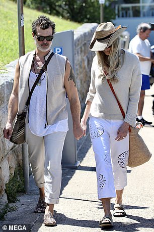 The pair walked hand in hand as Elle showed her boyfriend around the popular tourist hotspot