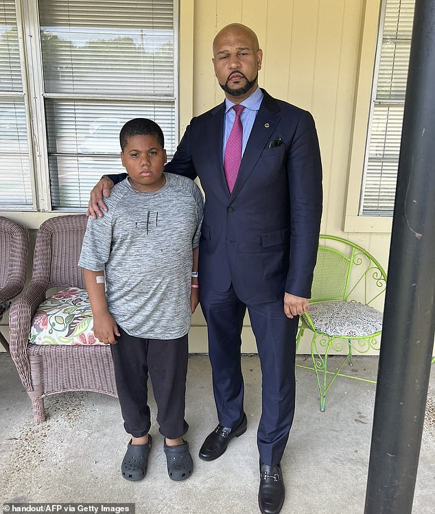 Aderrien's lawyer Carlos Moore (right) said the release of the bodycam footage was important for transparency surrounding the case