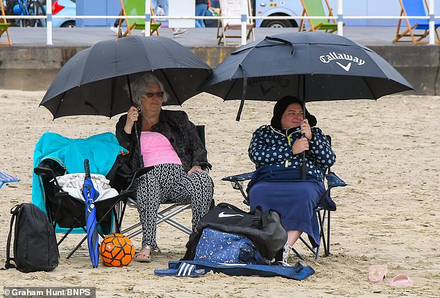 For Britons, the new record may be hard to believe as the country was hit by cold air and rain for much of the summer, despite heatwaves in mainland Europe.  However, CS3 provides an average for the year for the entire world, so colder than normal conditions in one country don't tell the whole story.  Holidaymakers are pictured on the beach in Weymouth, Dorset, on July 31, 2023