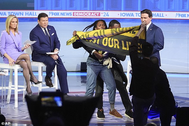 Security removed the hecklers when DeSantis said, “Well guys, that was a mistake.  You didn't understand that correctly.  OK'