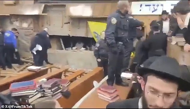 Members of the synagogue on Monday tore away interior wooden panels to reveal the entrance to the tunnel and entered to prevent the tunnels from being filled.