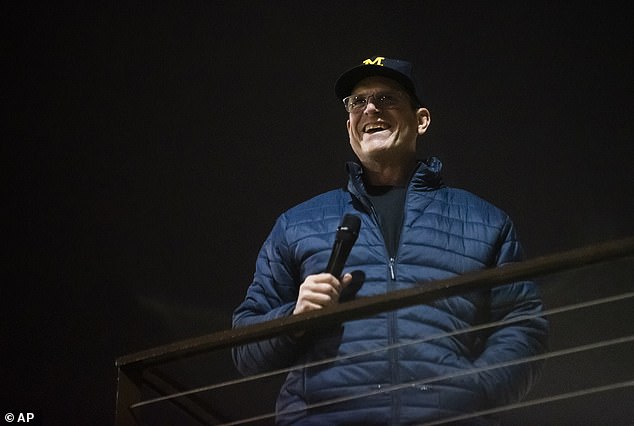 Jim Harbaugh and his players were greeted by thousands of fans in Ann Arbor