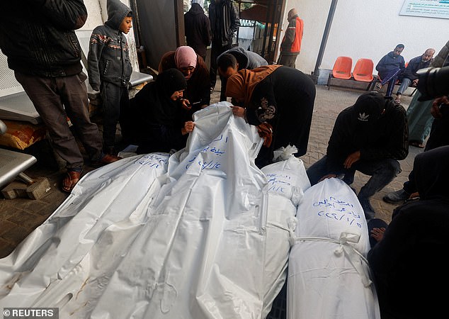 Mourners react next to the bodies of Palestinians killed in an Israeli attack, amid the ongoing conflict between Israel and the Palestinian Islamist group Hamas, at the Abu Yousef Al Najjar Hospital in Rafah, southern Gaza Strip, January 5