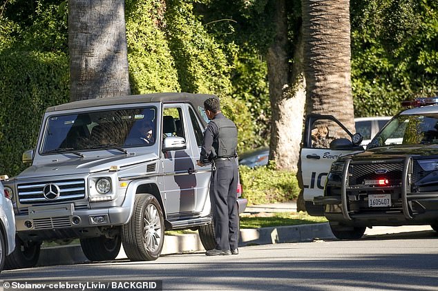 A Beverly Hills police SUV was stopped a few feet behind Kendall's sleek vehicle, which came to a stop on the side of a road