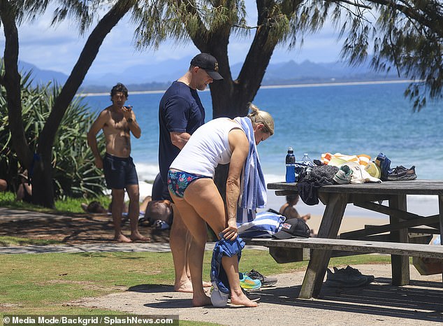 Zara looked ready for a day at the beach in a blue striped towel and sporty bikini