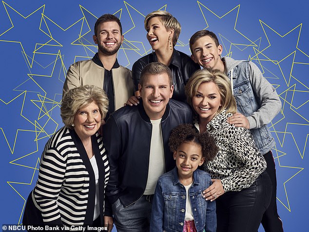 Todd and Julie Chrisley were famous for their hit show Chrisley Knows Best.  They are pictured with their family in a promo for season eight of the series.  From left to right: Faye Chrisley, Chase Chrisley, Todd Chrisley, Savannah Chrisley, Chloe Chrisley, Julie Chrisley and Grayson Chrisley