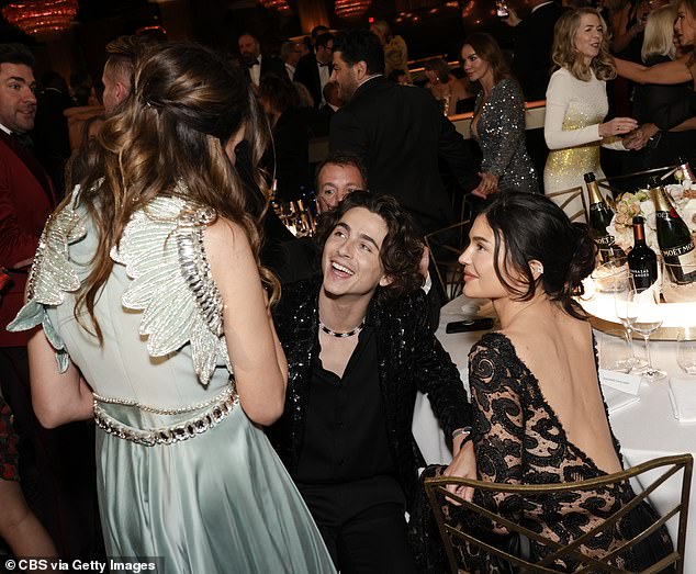 Timothee and Kylie stayed close throughout the ceremony, with the reality star maintaining physical contact with her partner as they chatted with other guests