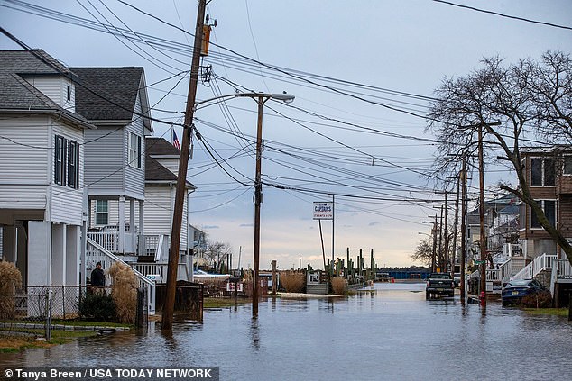 Floodwaters can be seen here Wednesday morning along Washington Avenue in Highlands, New Jersey