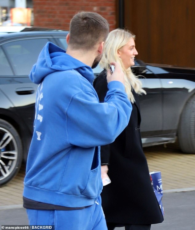 The footballer looked casual in a blue tracksuit as he went shopping at Marks and Spencer during a break from training