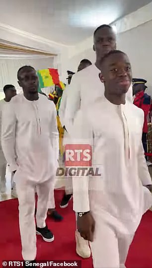 Mane (left) found himself wearing an all-white dress again just two days after his wedding