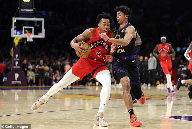 Scottie Barnes is defended by Los Angeles Lakers guard Max Christie on Tuesday night