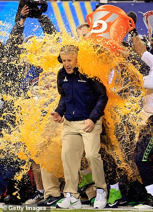 Pete Carroll is drenched in his Seahawks players